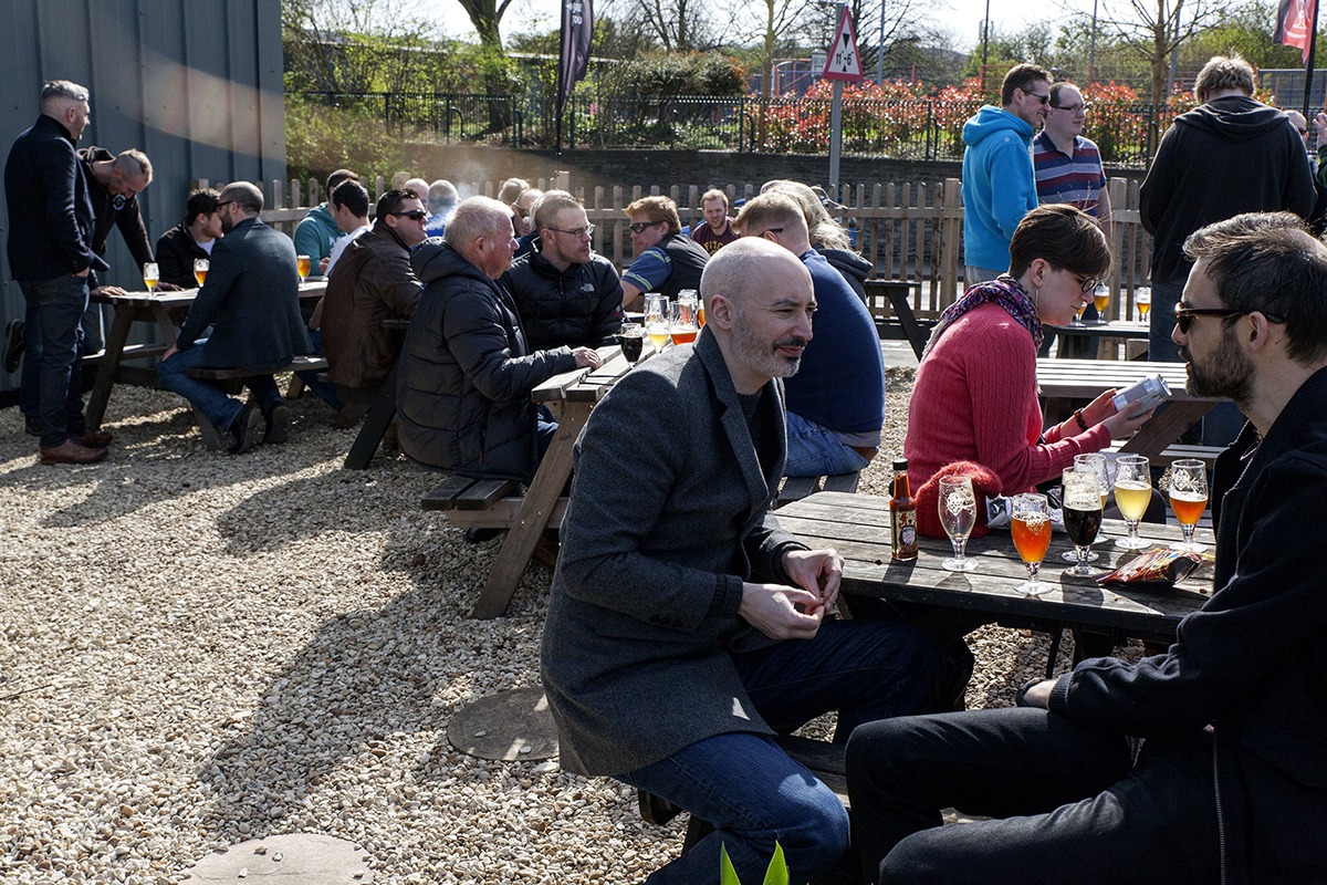Guests tasting third-pint measures of craft beer on the Bristol beer tour